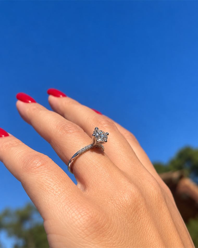 Round brilliant diamond solitaire ring on a pavé shank